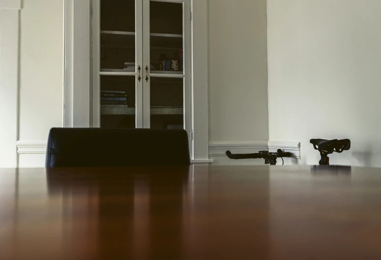 an empty room with gun lying on the floor