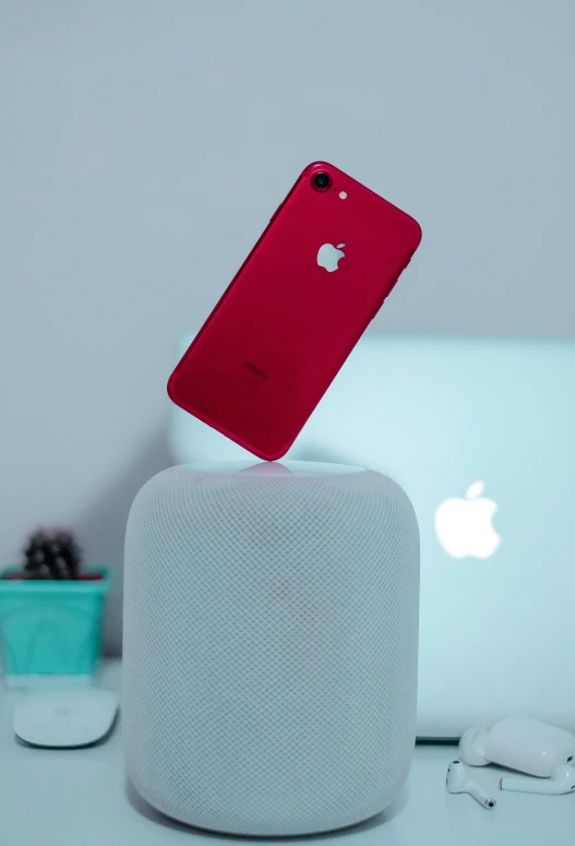 an iphone sticking up from a device holder