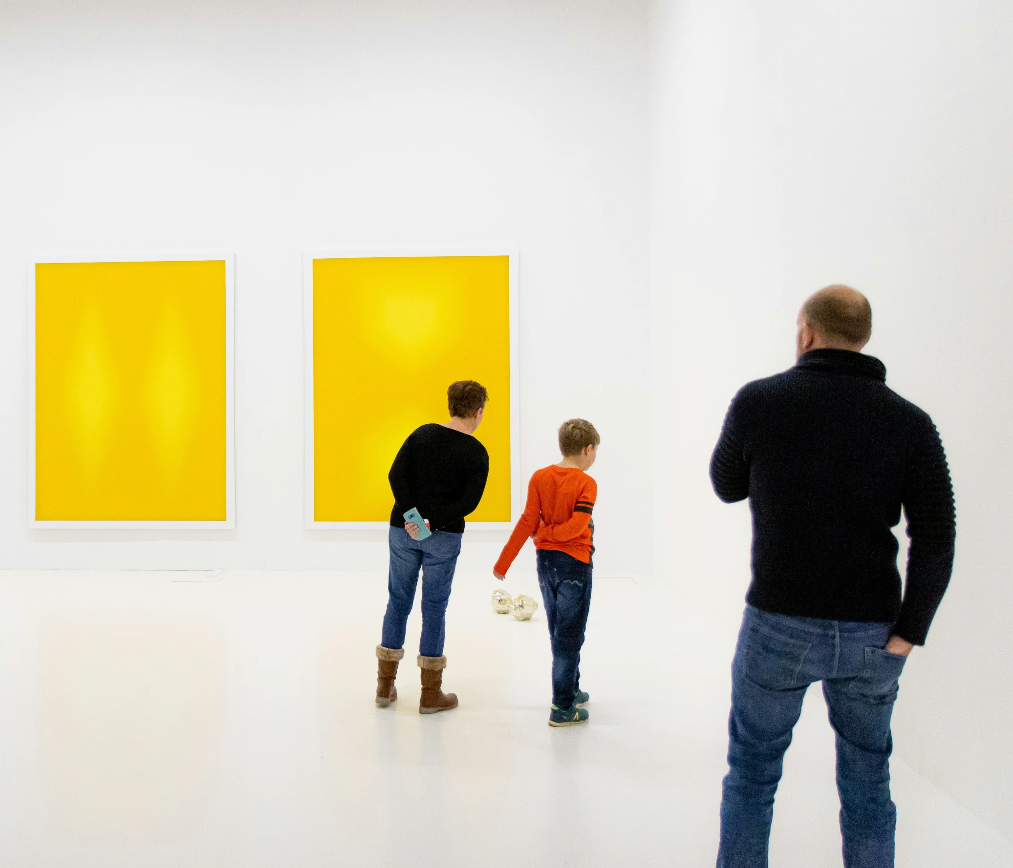 people looking at artwork in an art museum