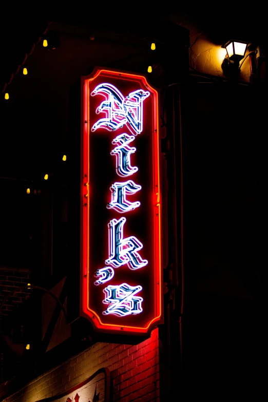 an oriental style illuminated sign on the side of a building