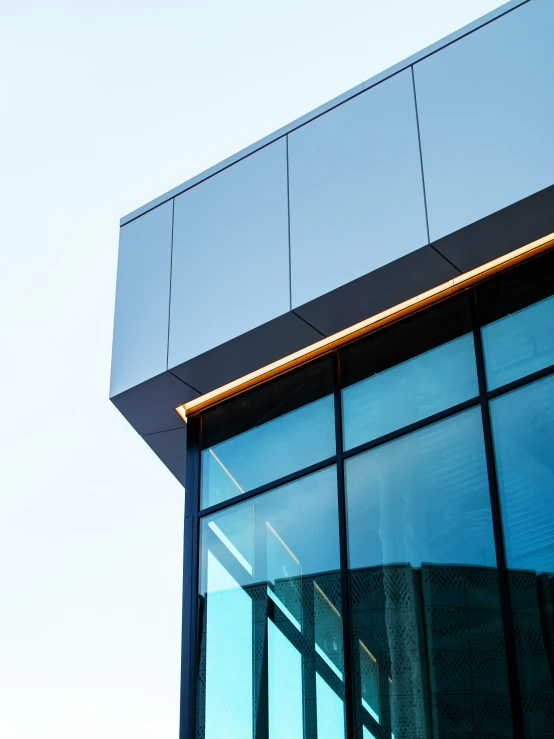 a modern building facade with glowing glass windows