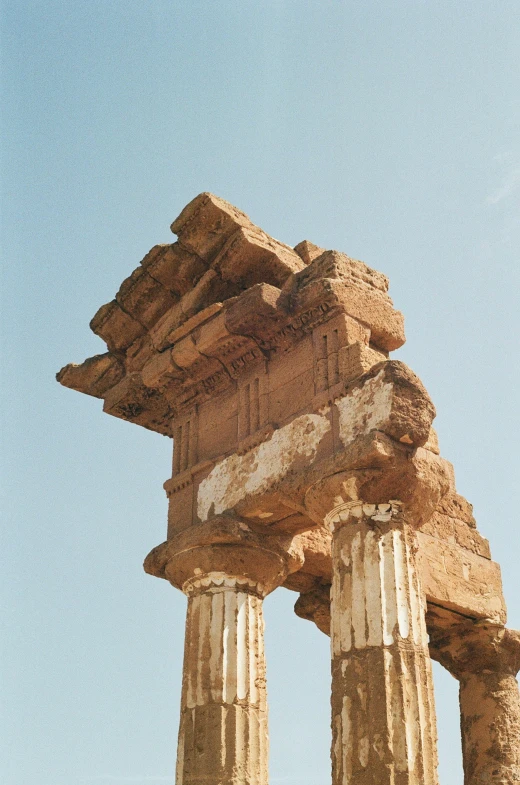 a stone structure against a clear blue sky