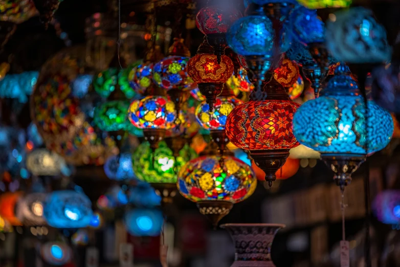 a display of glass lanterns hanging from the ceiling