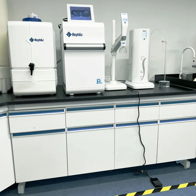 a large lab area with white medical equipment
