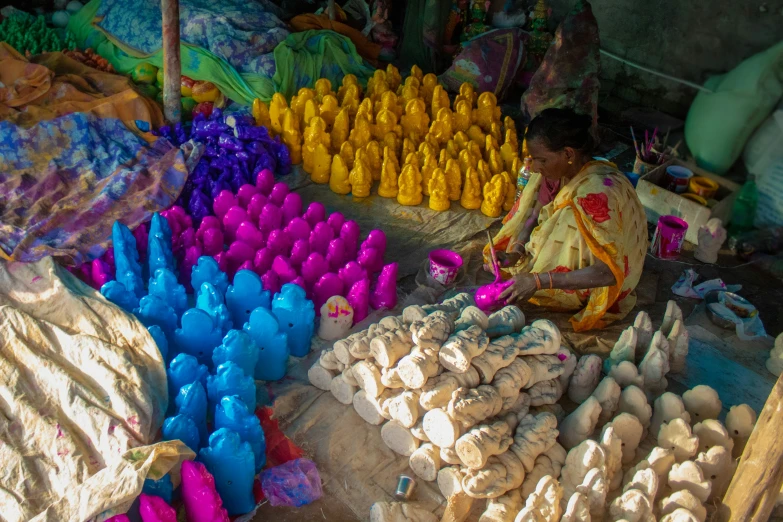 a person selling eggs and flowers at an outdoor market