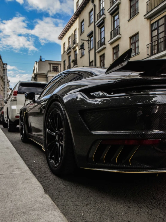 some cars are parked along the side of the street