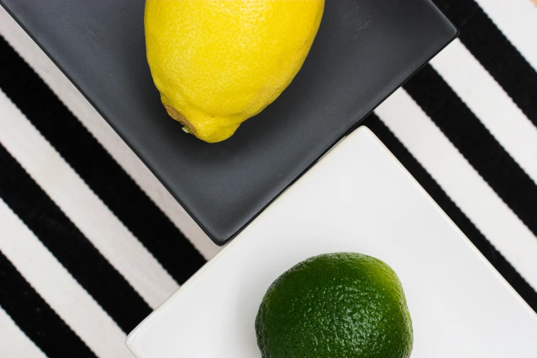 the lime has been placed next to the whole lemon