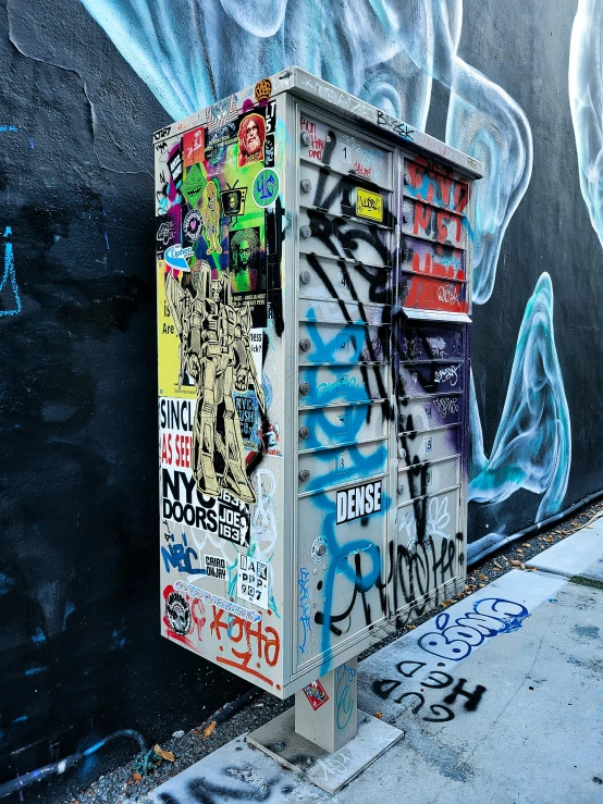 a dumpster has been spray painted on it's side