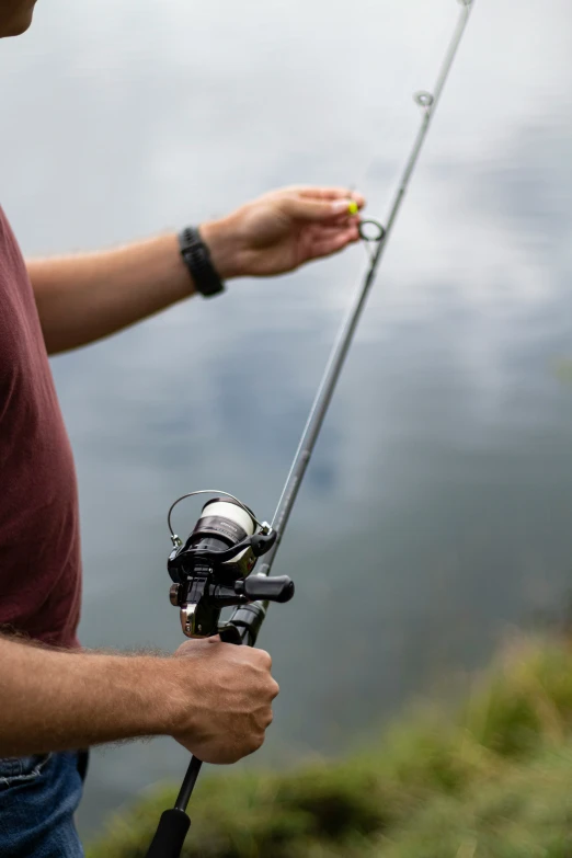 a man that is holding a fishing rod