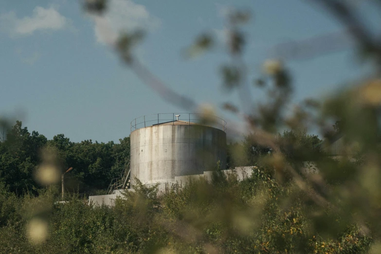 there is a large water tank on the top of a building