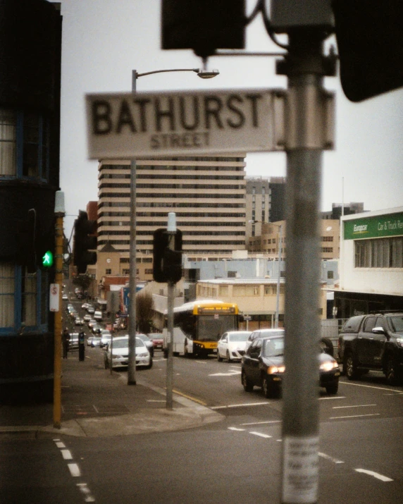 a sign saying bathurist is on the top of a traffic light pole