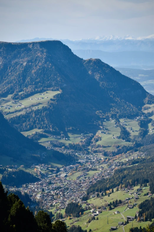 view from a hilltop on many small towns nestled in mountains