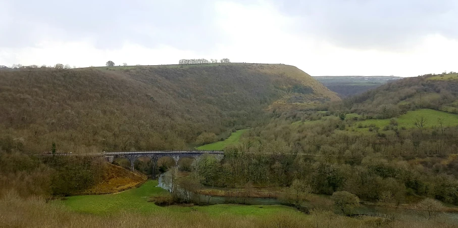 the valley is filled with a bridge to the side