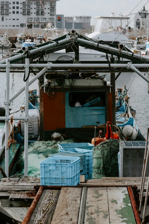 a boat tied to the deck with lobsters on it