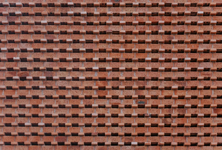 a brick building with an orange and brown design