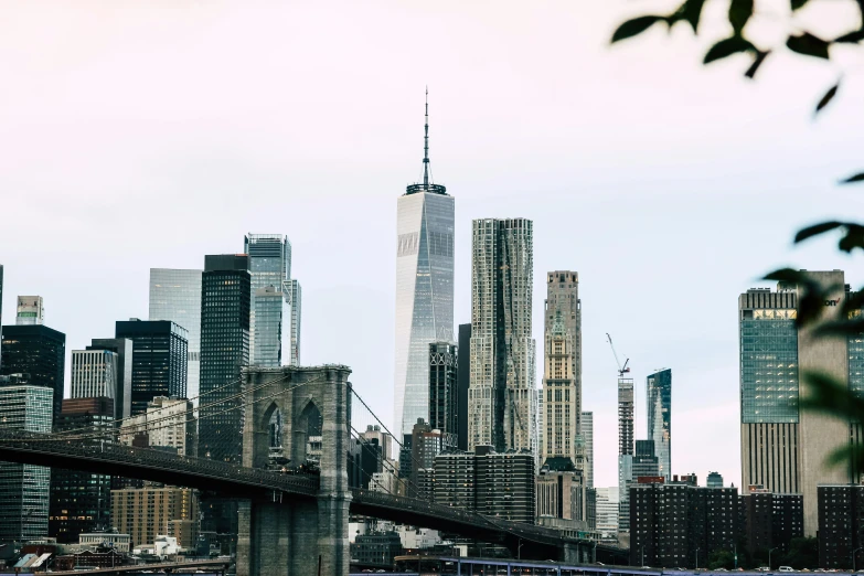 a large cityscape in the midst of a cloudy day