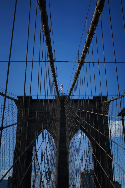 the view from underneath of a tall bridge