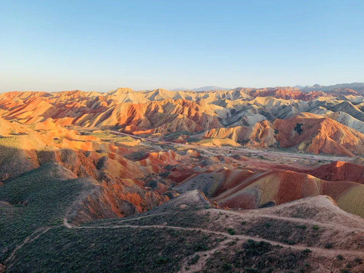 a scenic view of mountains and valleys at dusk