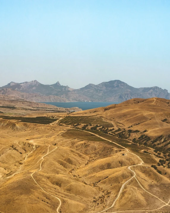 the desert mountains are near a body of water