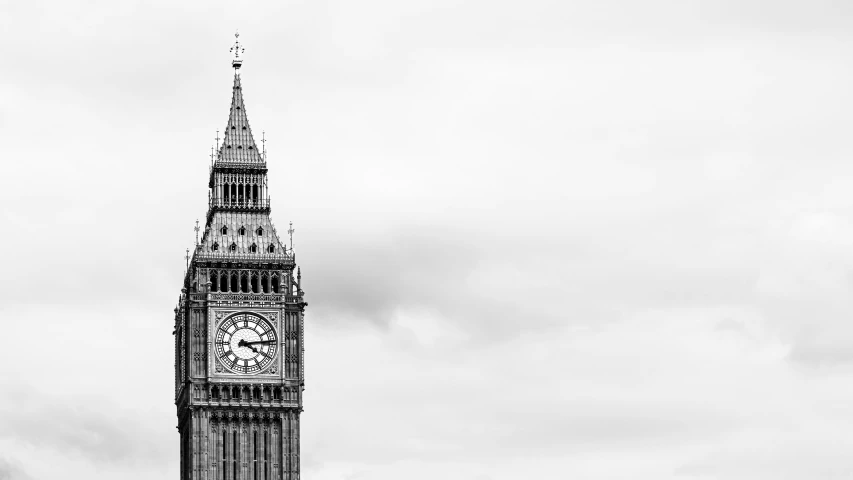 a very tall clock tower towering over the city of london