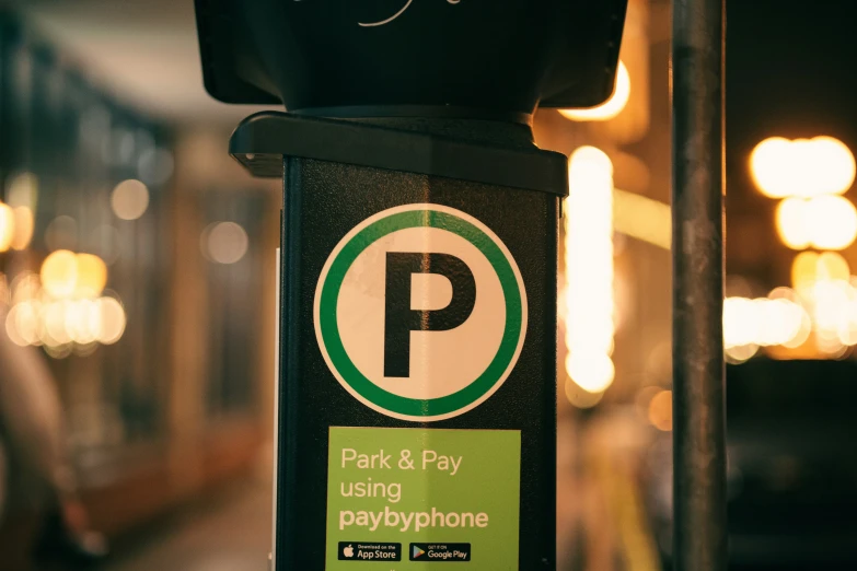 parking meter sign and lights in dark street