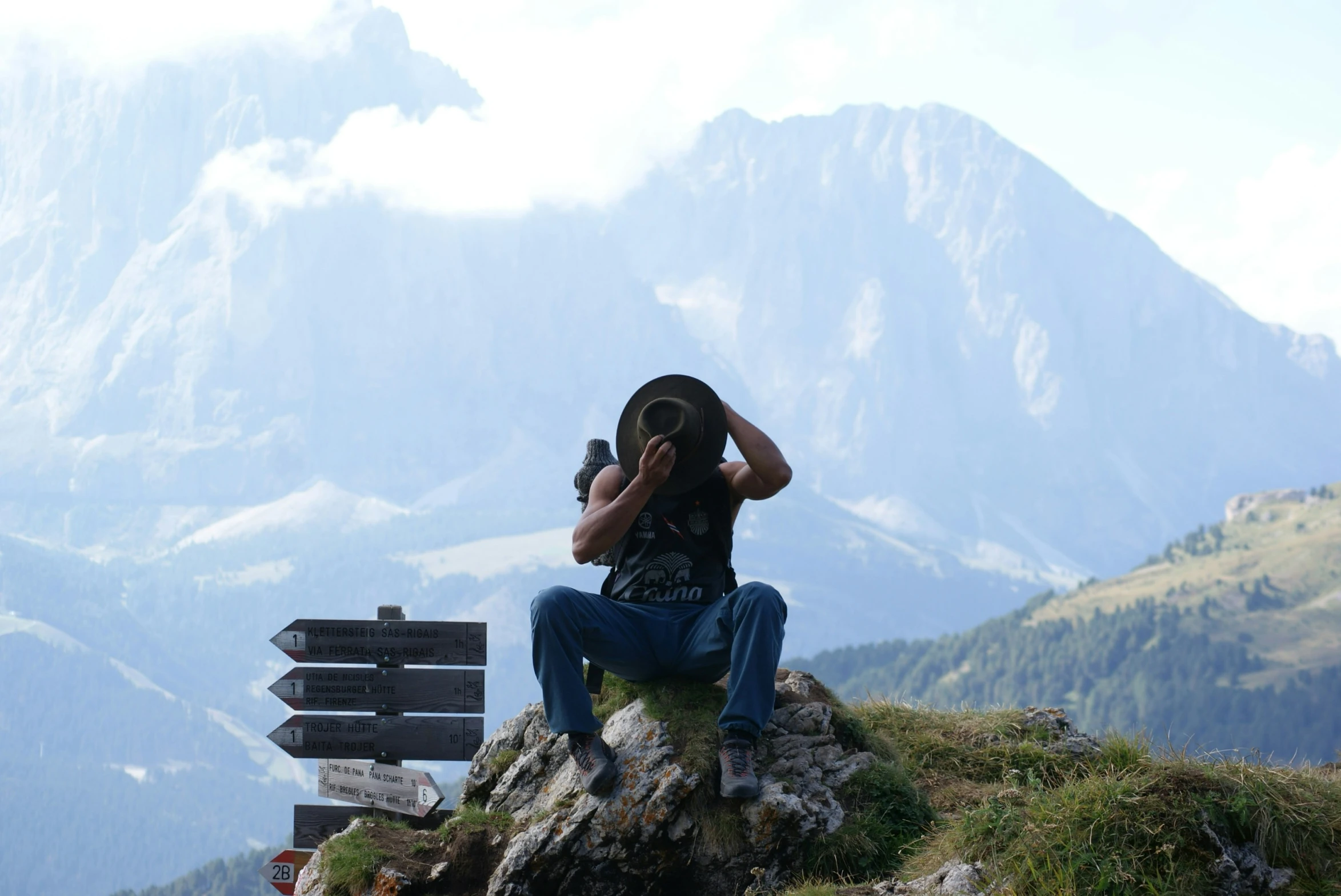 a person taking a picture of a mountain