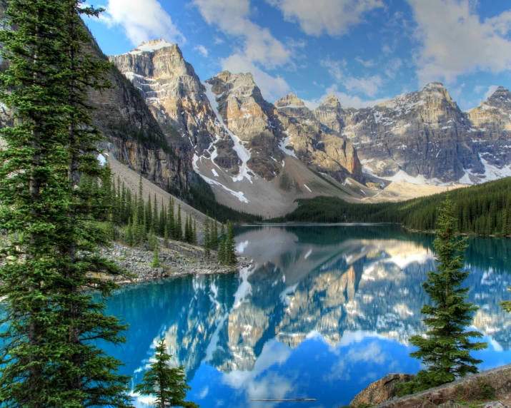 a beautiful mountain landscape is shown with blue water