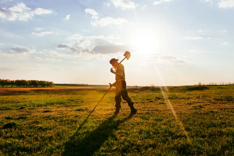 a man standing on top of a lush green field