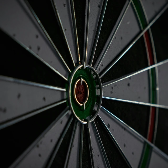 a dart hitting an arrow in a bulls eye view