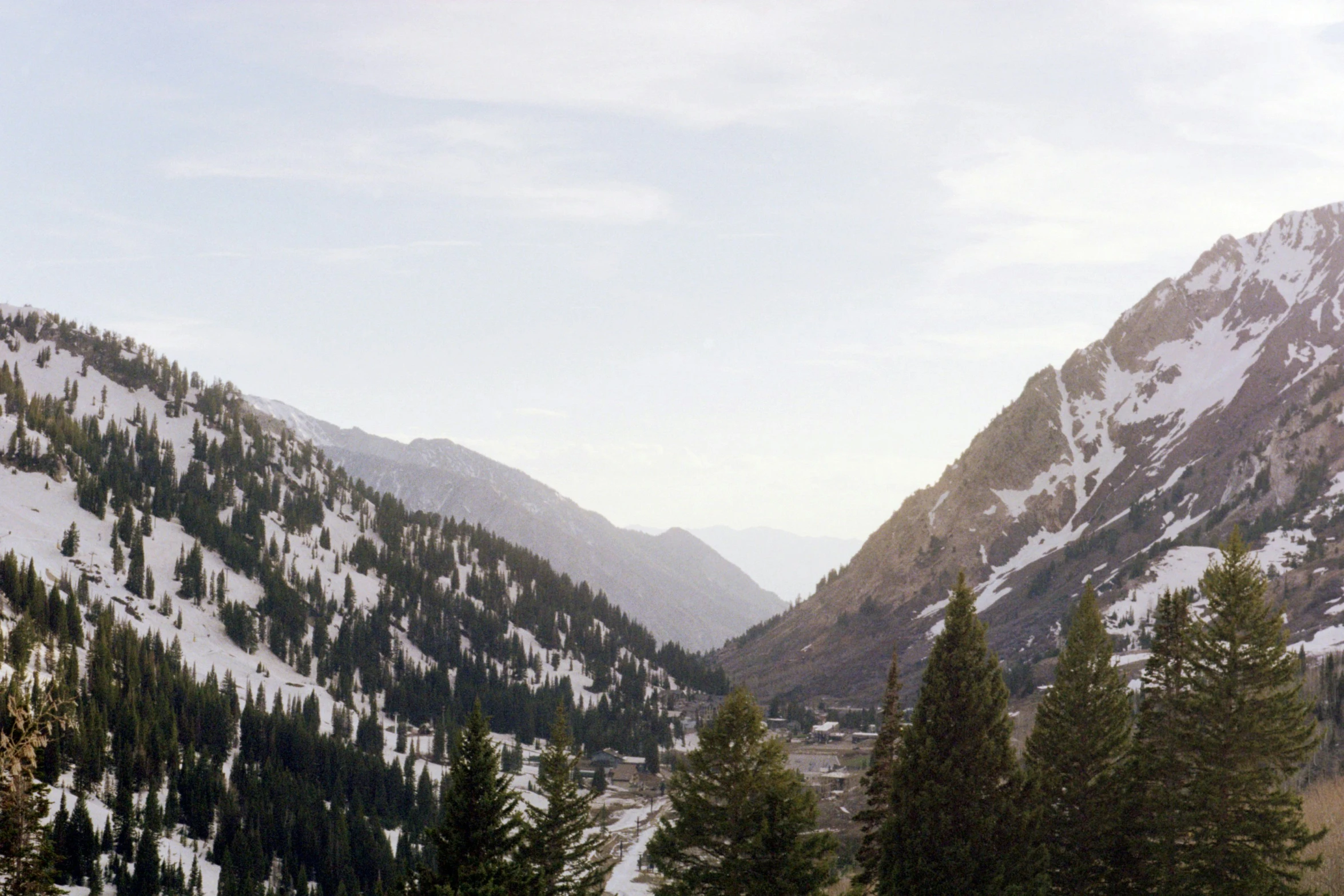 a mountain valley filled with lots of snow