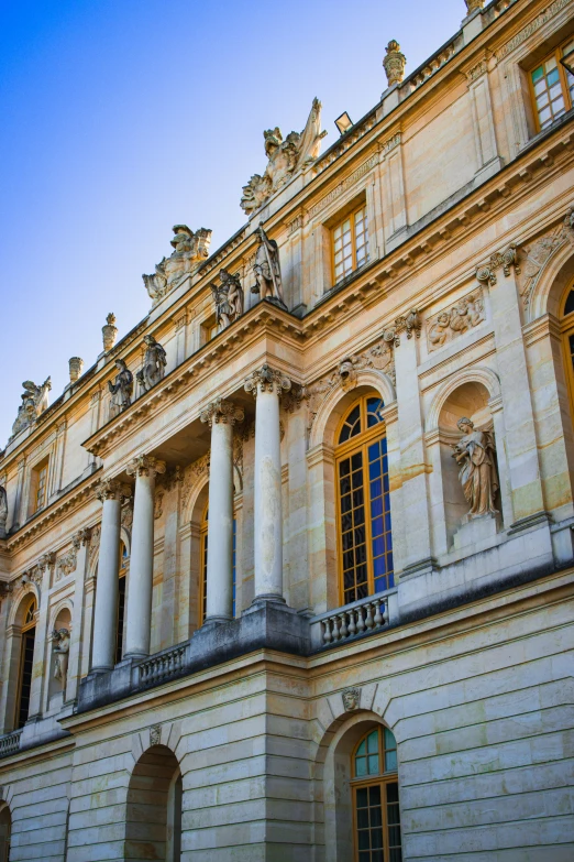 a very ornate stone building with a yellow window