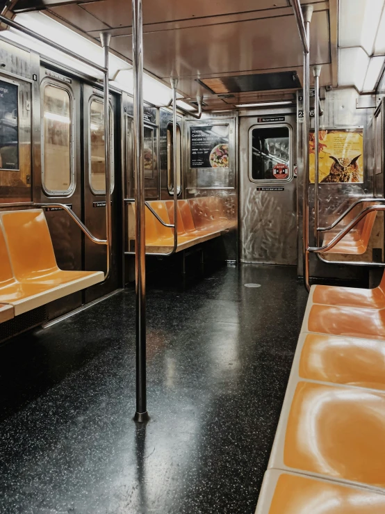 a train station with seats and other subway equipment