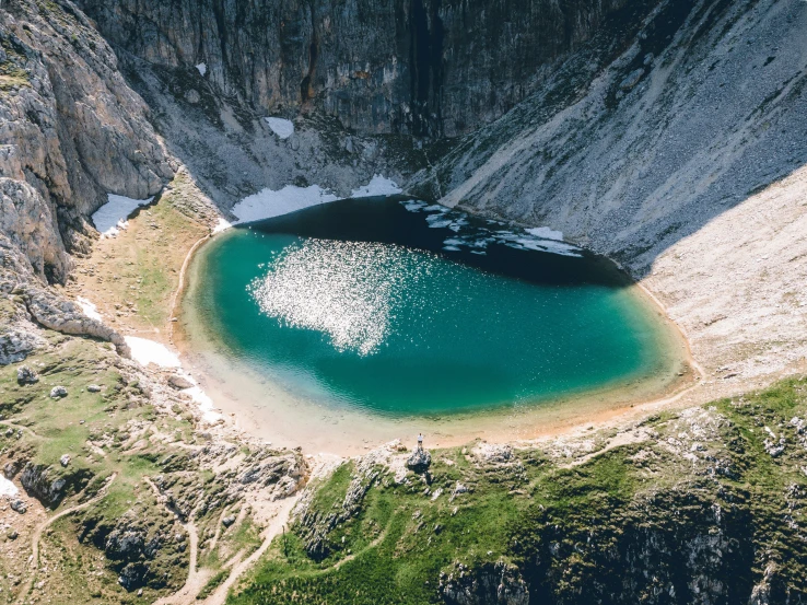 a big mountain with some water in it