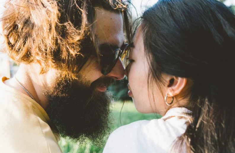 a couple is sharing an intense kiss while outside