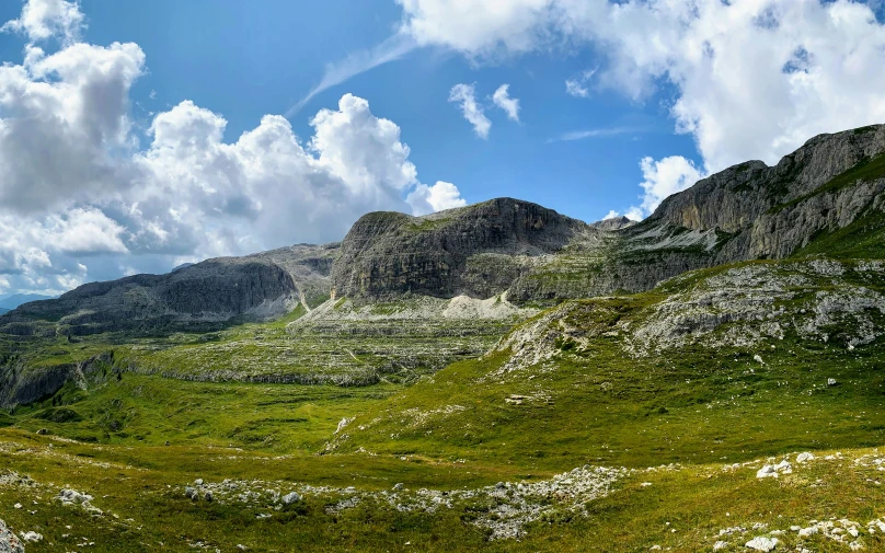 the mountains and grass on a clear day