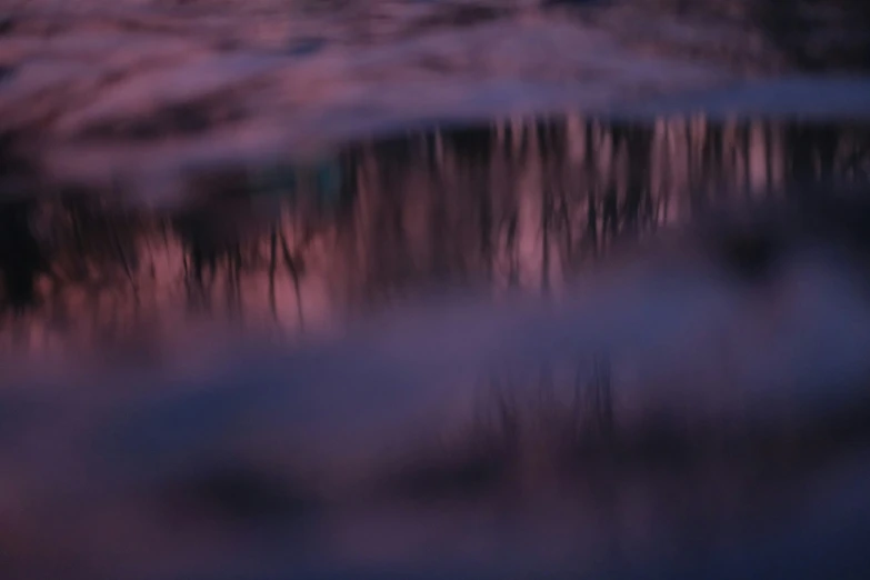 the sky is getting pink on this lake