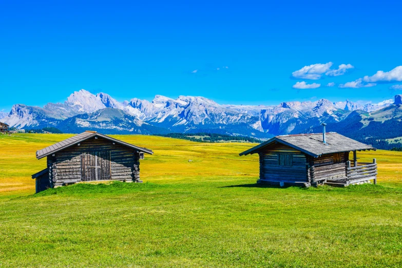 some cabins are on a hill in the middle of nowhere