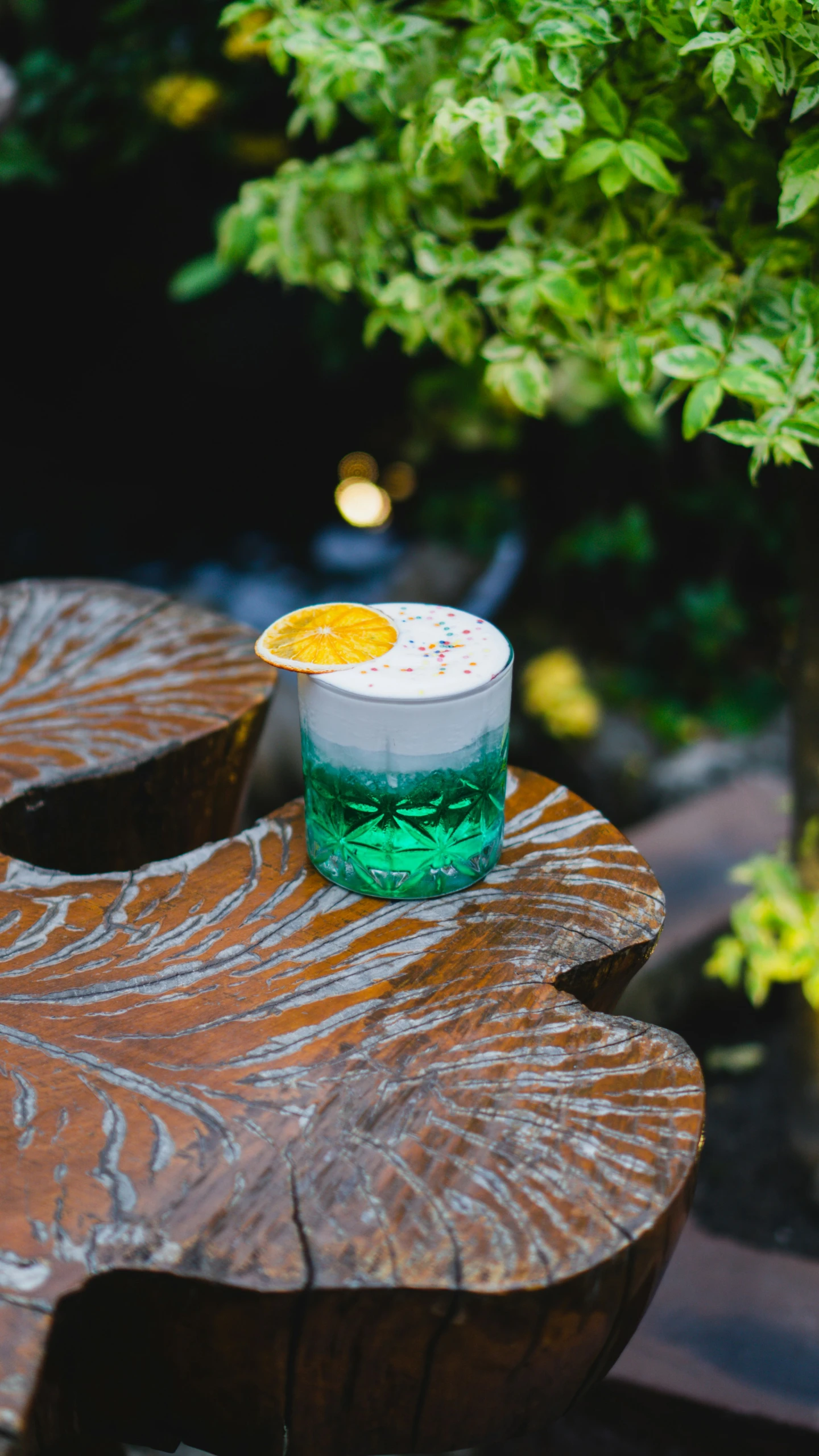 a small cup sitting on top of a wooden table