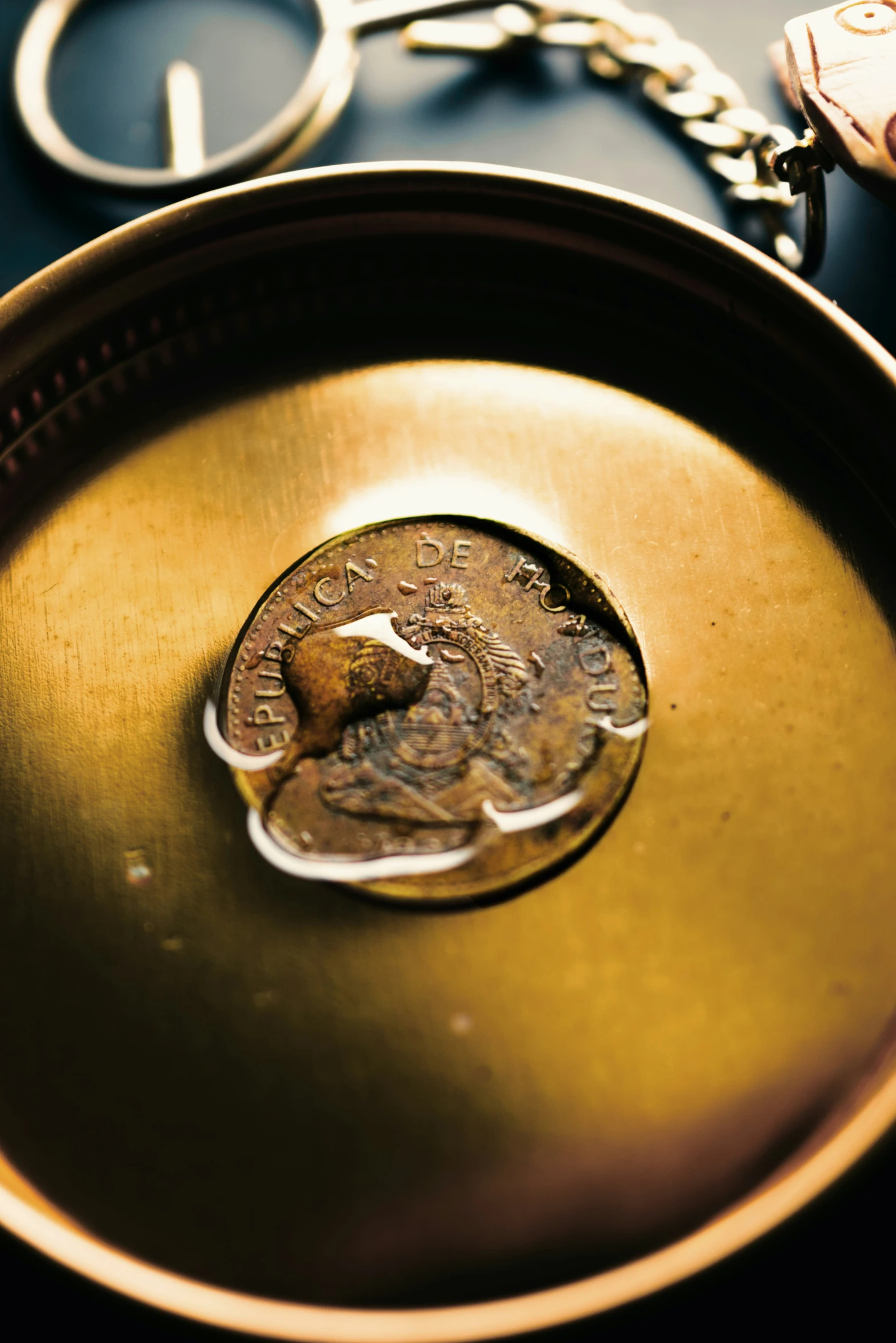 a penny sits in the middle of an oval tray