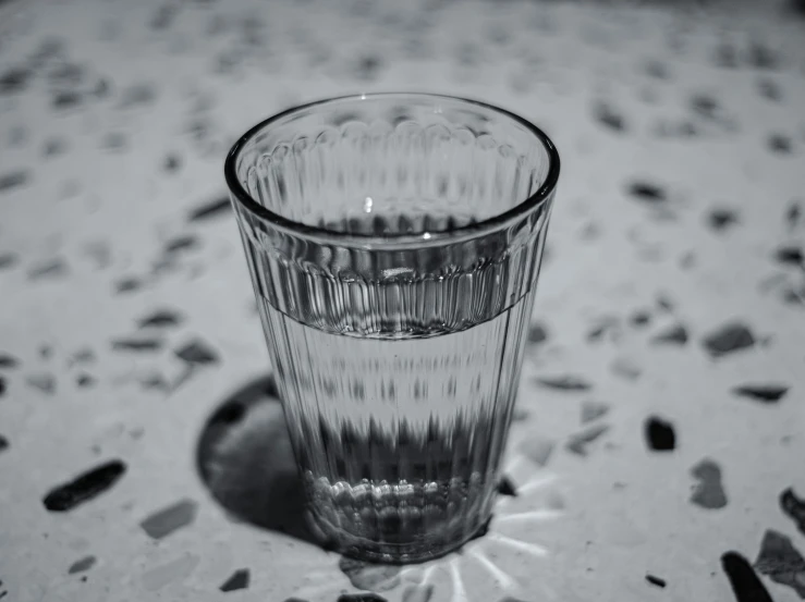 the glass cup is empty on a table