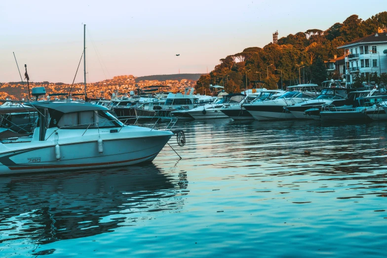 the boats are parked at the pier in the harbor