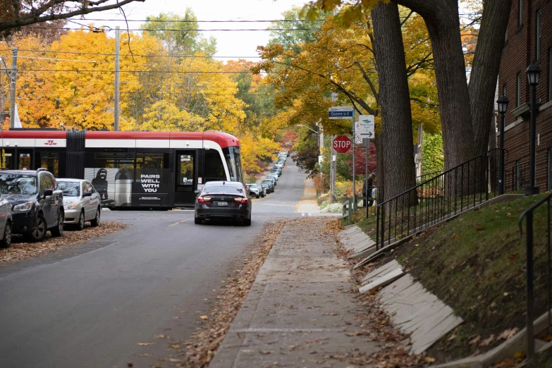 a bus that is going down the street