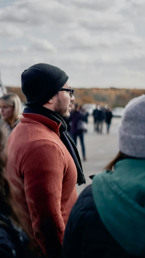 a crowd of people standing next to each other