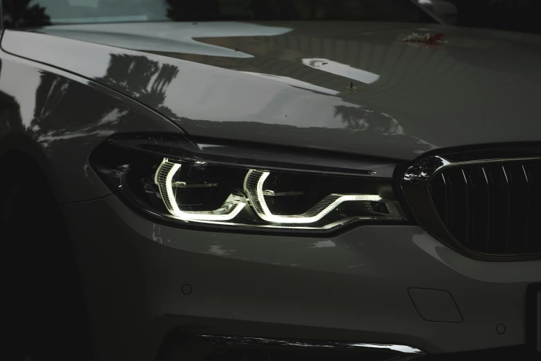 a bmw's headlight on display at an event