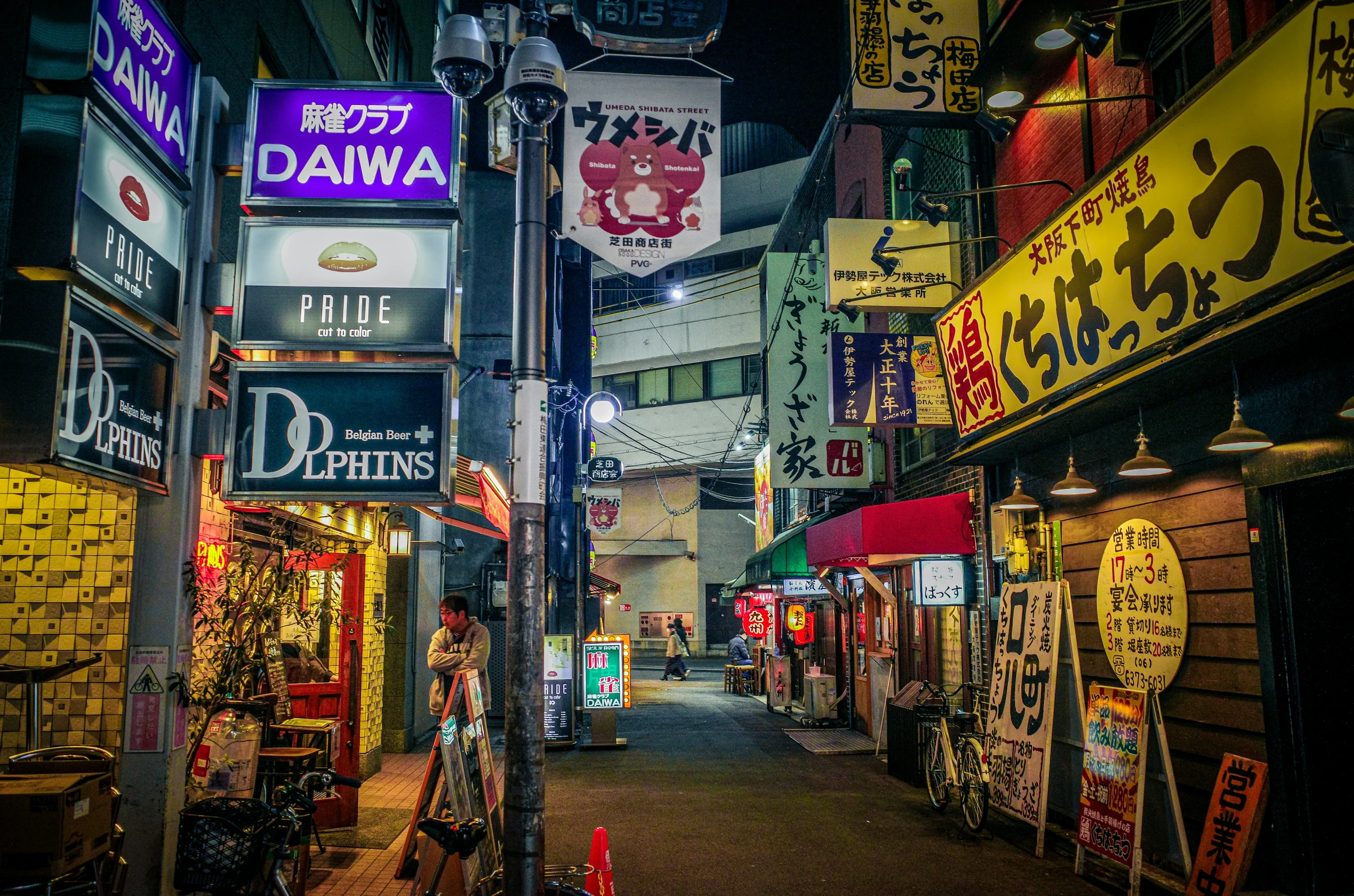 an alley way that has many different signs on it