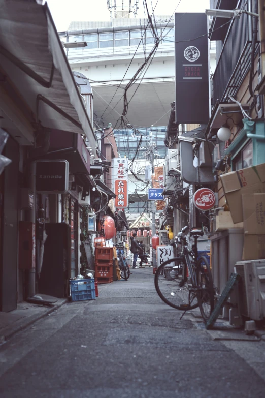 bikes and a car on a narrow street