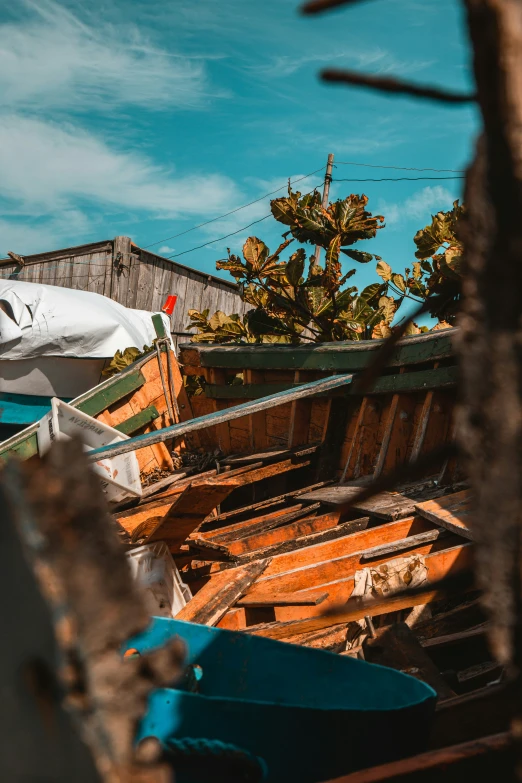 the hull of a boat has been pulled away from the shore