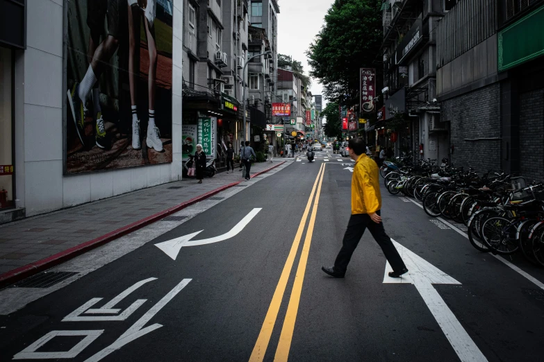 a person walking down the middle of the street