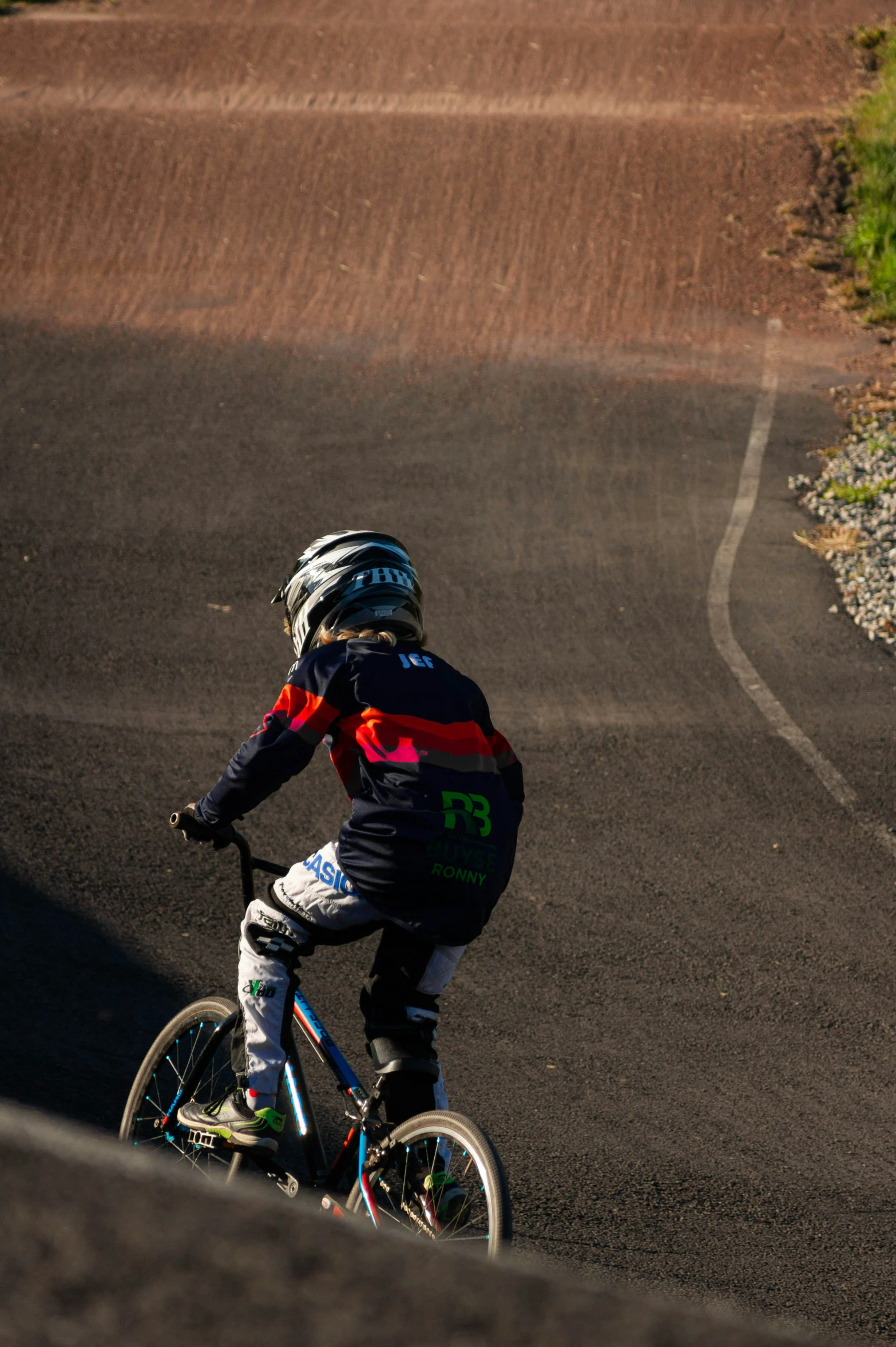 a  rides a bicycle down a country road