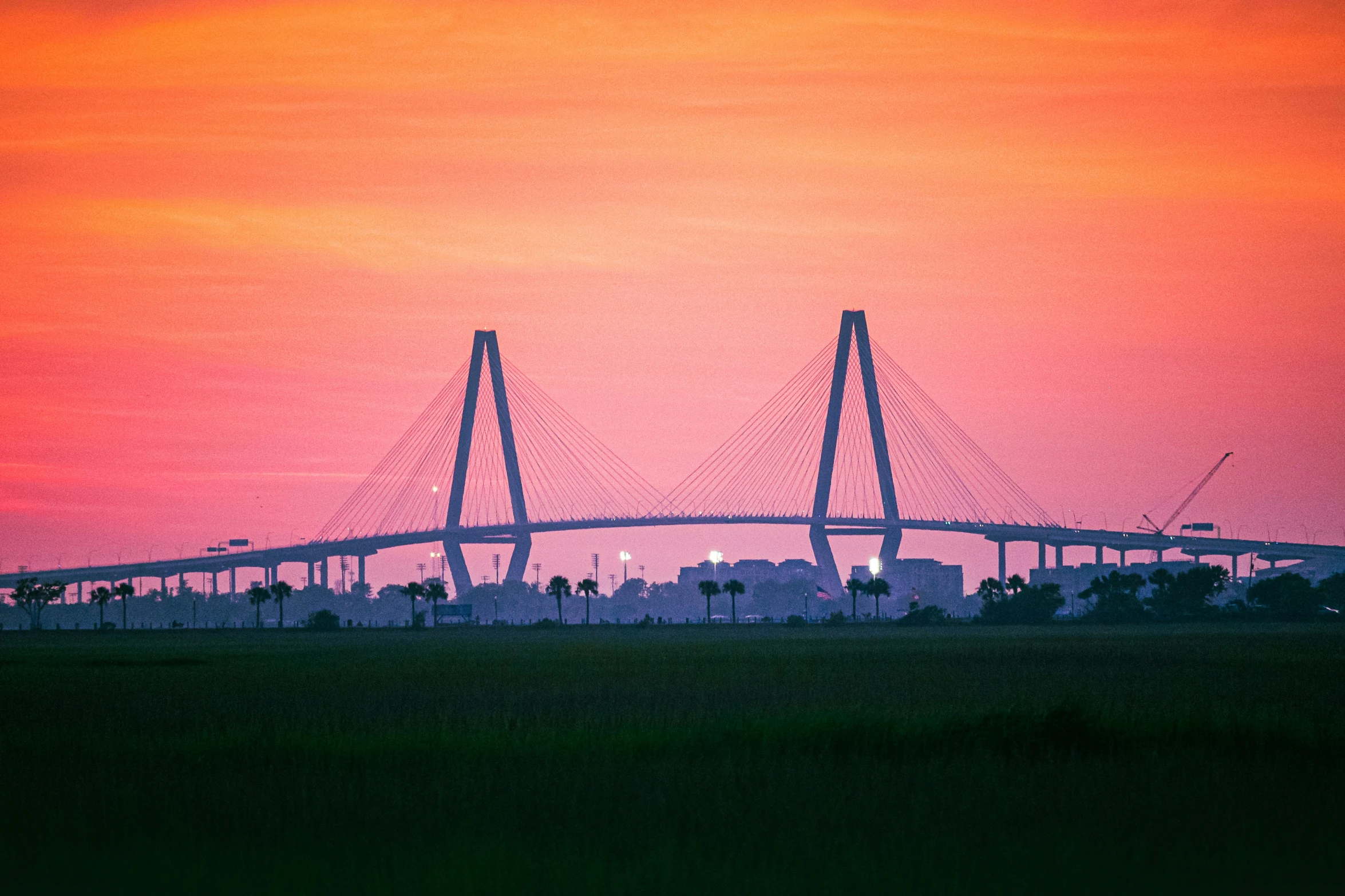 the silhouette of the bridge against the sunset